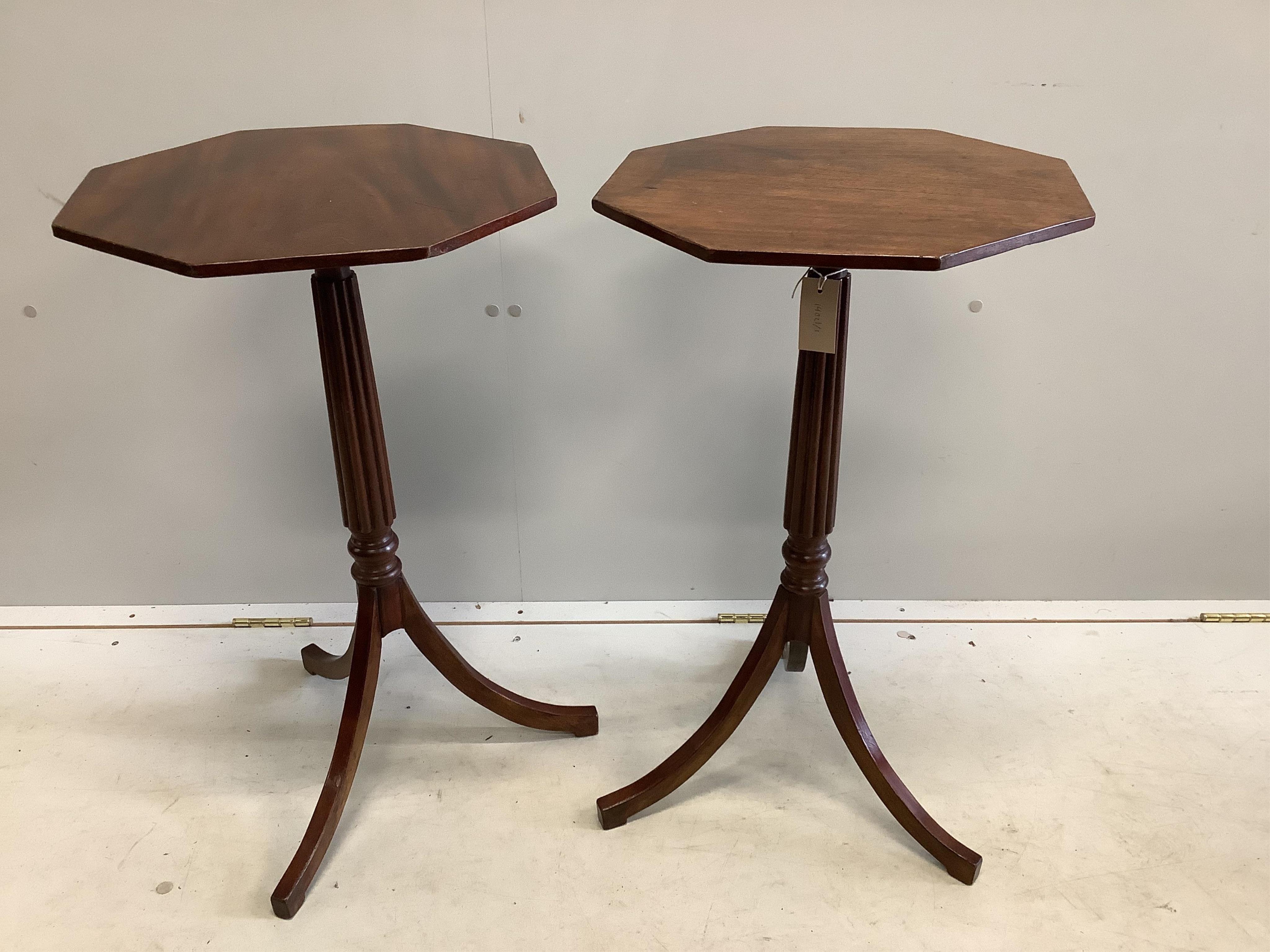 A pair of Regency style octagonal mahogany tripod wine tables, width 41cm, height 71cm